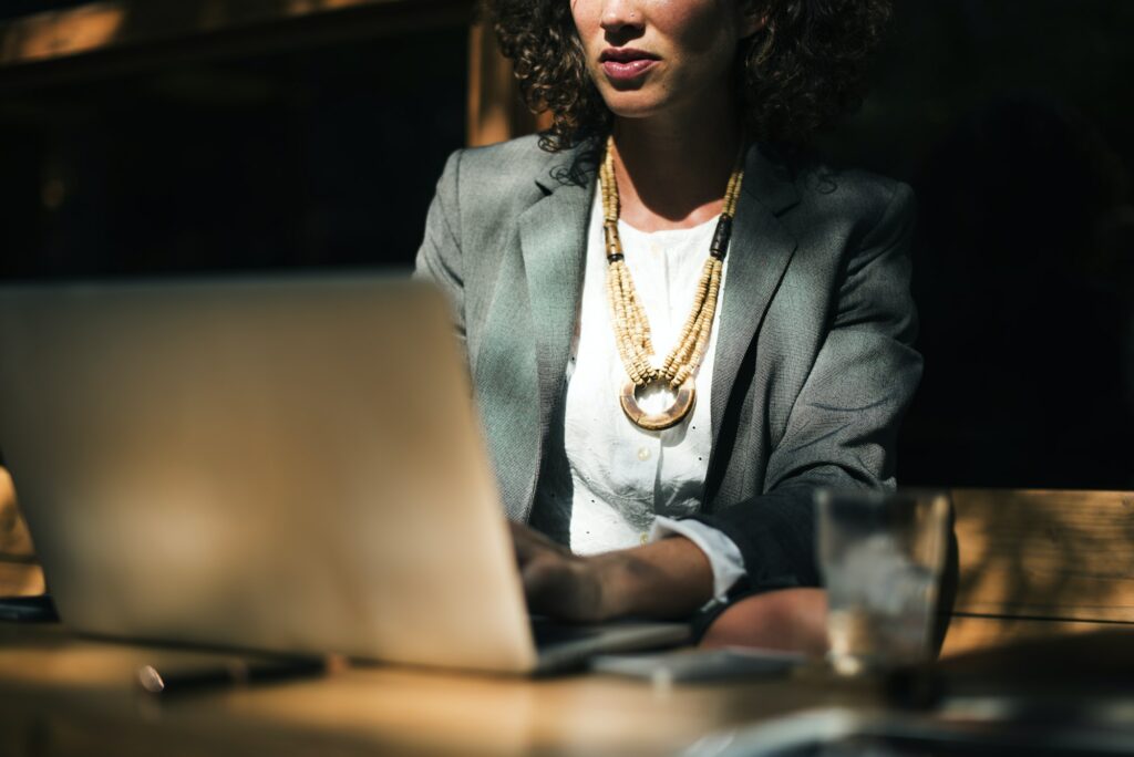 Woman working with laptop at coffee shop